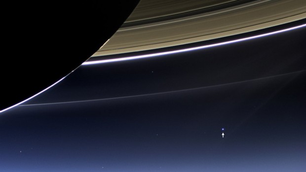 this-humbling-photo-taken-by-nasas-cassini-spacecraft-in-2013-shows-what-earth-indicated-by-the-tiny-white-arrow-looks-like-from-898-million-miles-away