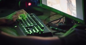 A tilted keyboard is seen as a PC player plays Valorant